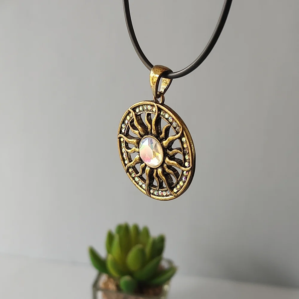 Radiant Gold Sunburst Necklace with Central Gem